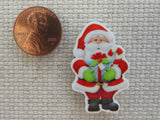 Second view of Santa with a Present Needle Minder,.