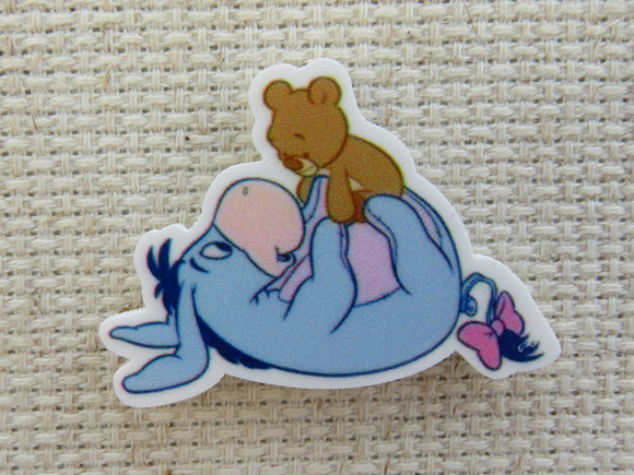 First view of Eeyore Playing with a Teddy Bear Needle Minder.