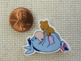 Second view of Eeyore Playing with a Teddy Bear Needle Minder.