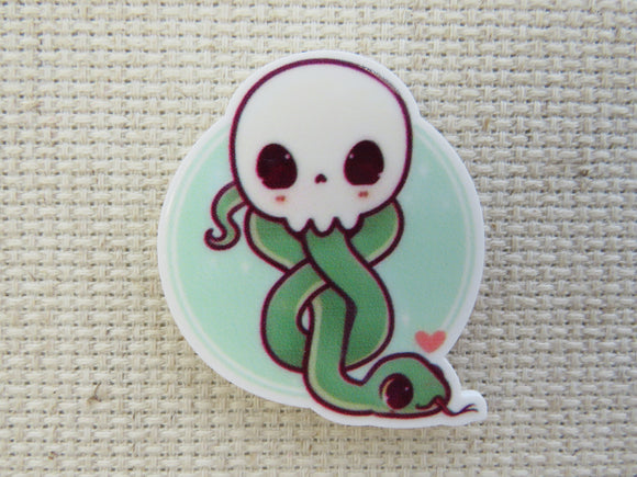 First view of Skull with a Green Snake Slytherin Out of It Needle Minder.