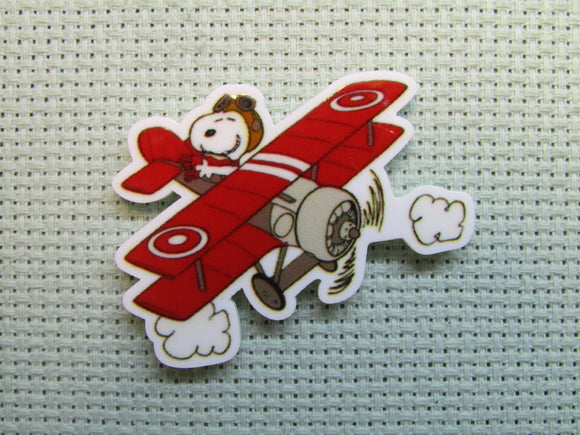 First view of the Snoopy Flying a Bi Plane Needle Minder