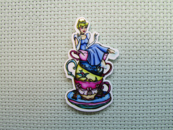 First view of the Cinderella Sitting on a Stack of Teacups Needle Minder