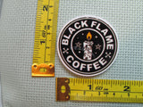 Third view of the Black Flame Coffee Needle Minder