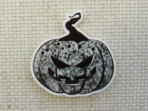 First view of Black and White Jack O Lantern Needle Minder.