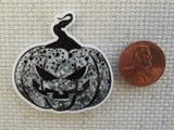 Second view of Black and White Jack O Lantern Needle Minder.