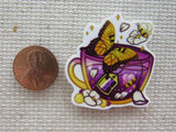 Second view of Butterfly and Bee Teacup Needle Minder.