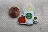 Second view of pumpkin coffee drink needle minder.