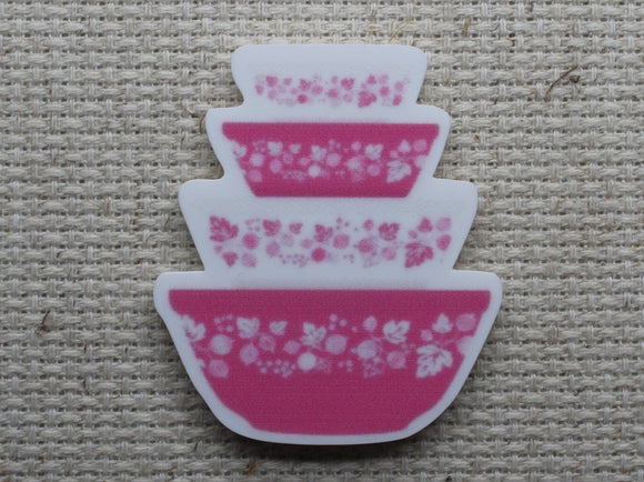 First view of vintage pink mixing bowls needle minder.