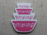 First view of vintage pink mixing bowls needle minder.