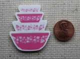 Second view of vintage pink mixing bowls needle minder.