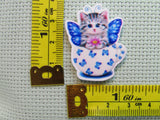 Third view of the Blue Butterfly Kitty Teacup Needle Minder