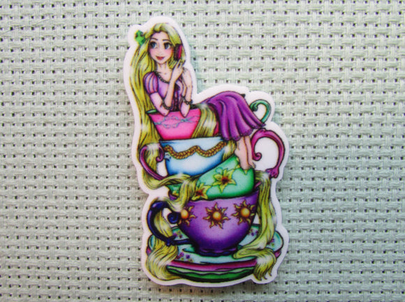 First view of the Rapunzel Sitting on a Stack of Teacups Needle Minder