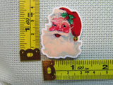 Third view of the Santa Face Needle Minder