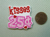 Second view of the Kisses 25 cents Needle Minder