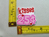 Third view of the Kisses 25 cents Needle Minder