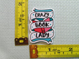 Third view of the Crazy Book Lady Needle Minder