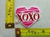 Third view of the XOXO Heart Needle Minder