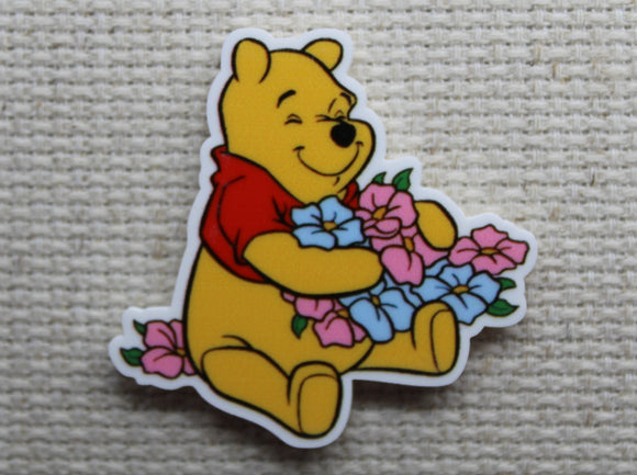 First view of Pooh Bear Hugging Beautiful Flowers Needle Minder.