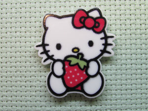 First view of the Cute White Kitty with a Strawberry Needle Minder