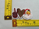 Third view of the Peace Love Santa Needle Minder