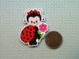 Second view of the Adorable Flower Holding Lady Bug Needle Minder