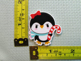 Third view of the Candy Cane Penguin Needle Minder