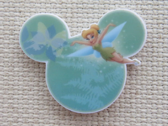 First view of Tinkerbell flying Across green Mickey eats needle minder.