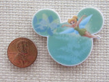 Second view of Tinkerbell flying across green Mickey ears needle minder.
