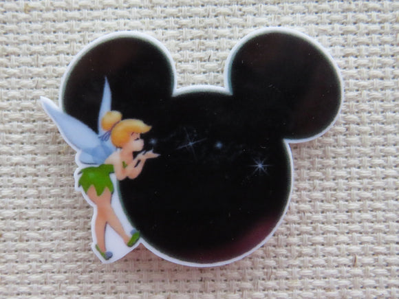 First view of Tinkerbell Blowing Pixie Dust Across a Black Mickey Head Needle Minder.