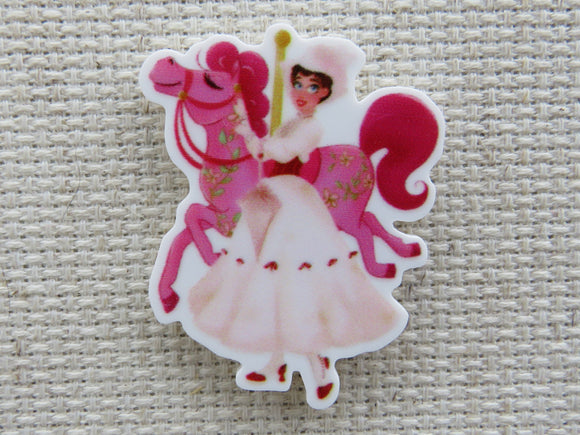 First view of Mary Poppins with a Pink Carousel Horse Needle Minder.