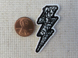 Second view of Black and White Lightening Bolt Filled with Wizarding Items Needle Minder.