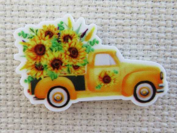 First view of Yellow Truck Full of Sunflowers Needle Minde.
