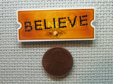 Second view of the Believe Ticket Needle Minder