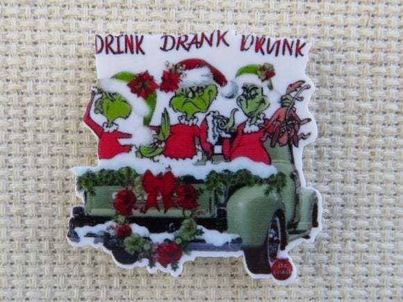 First view of Three Grinches in the Back of a Green Truck Needle Minder.