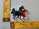 Third view of the Running Horses Needle Minder