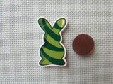 Second view of the Green Swirl Bunny Needle Minder