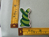 Third view of the Green Swirl Bunny Needle Minder