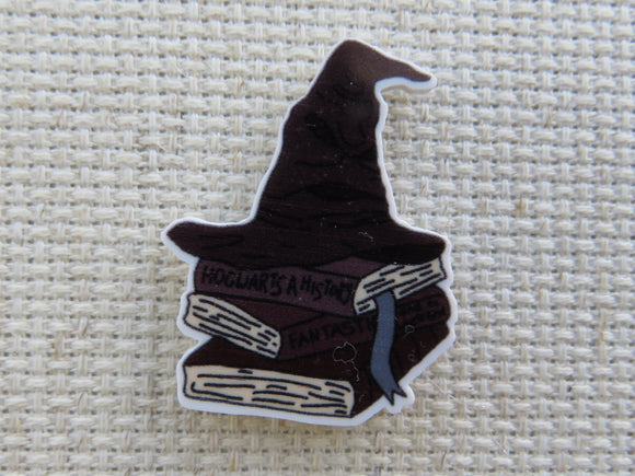 First view of The Sorting Hat Sits Atop a Stack of Books Needle Minder.