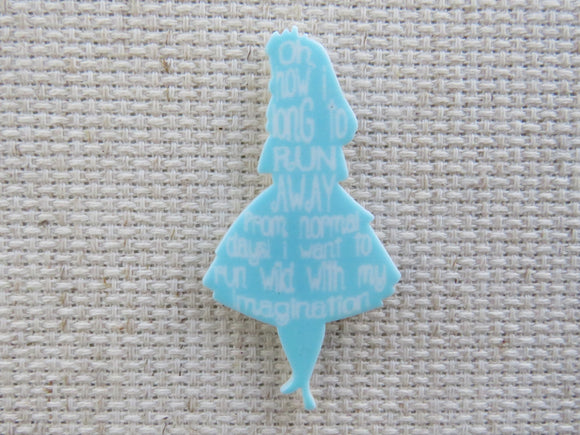 First view of Alice in blue with words from the story Needle Minder.