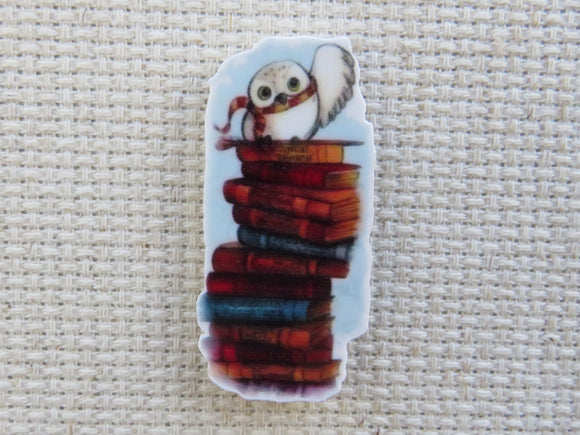 First view of Waving Owl on a Stack of Books Needle Minder.