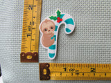 Third view of the Baby Sloth on a Candy Cane Needle Minder