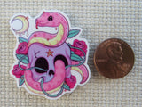 Second view of Pink Snake Slithering Through a Skull Needle Minder.