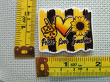 Third view of the Peace Love Sunshine Needle Minder