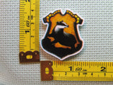 Third view of the Hufflepuff House Crest Needle Minder