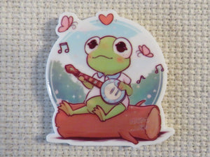 First view of Baby Kermit Sitting on a Log Needle Minder.
