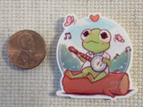 Second view of Baby Kermit Sitting on a Log Needle Minder.