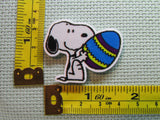 Third view of the Snoopy Holding an Easter Egg Needle Minder