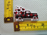 Third view of the Black and Red Truck Full of Hearts Needle Minder