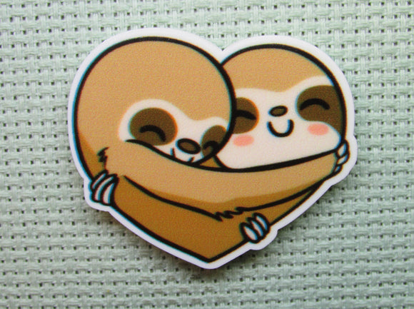First view of the A Pair of Heart Hugging Sloths Needle Minder