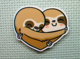 First view of the A Pair of Heart Hugging Sloths Needle Minder